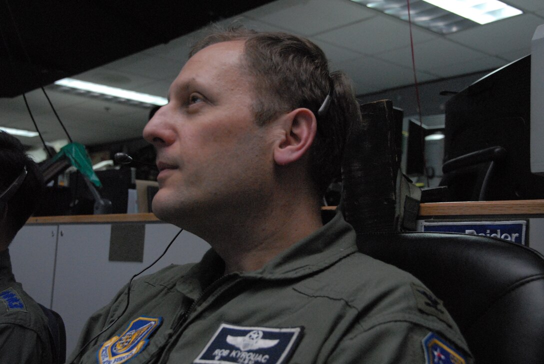 OSAN AIR BASE, Republic of Korea -- Colonel Rob Kyrouac, 607th Air and Space Operations Center chief combat operations division, oversees operations on the “pit floor” in support of Exercise Key Resolve here March 2 through 5. Key Resolve is an "operational-level," Republic of Korea-U.S. training exercise held peninsula-wide to ensure “operational” readiness of air, space and cyberspace operations in the Korean theater of operations. This annual exercise is held in conjunction with Foal Eagle 2008. Both exercises demonstrate U.S. resolve to support the Republic of Korea against external aggression while improving ROK/U.S. combat readiness and joint/combined interoperability. The “pit floor” is populated with people across the spectrum of specialties where operational-level decisions take place.  (U.S. Air Force photo/Staff Sgt. Lakisha Croley)