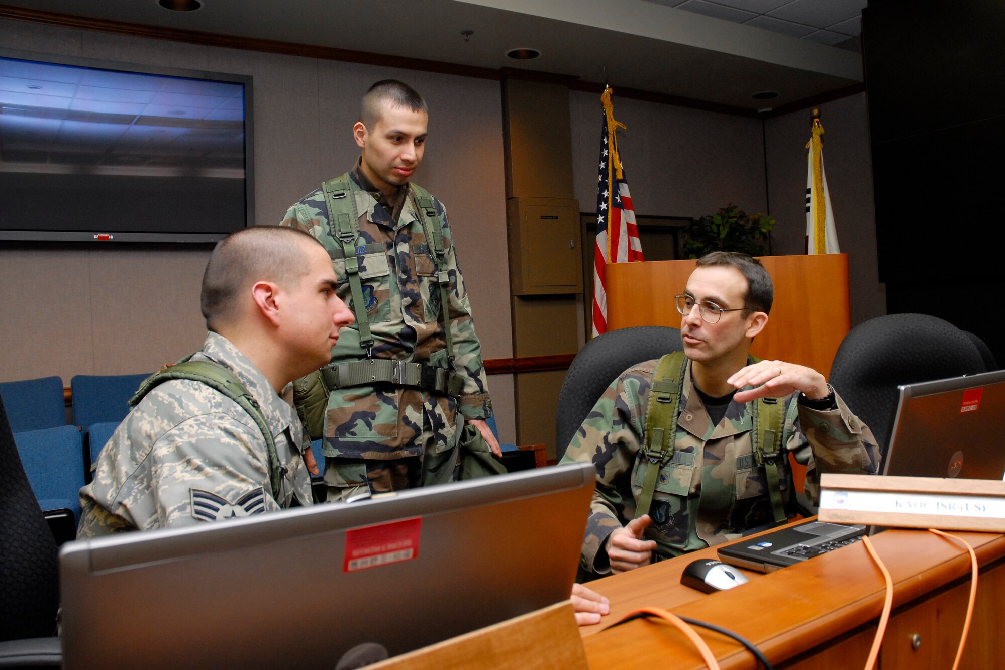 OSAN AIR BASE, Republic of Korea – Col. David “Spock” Johnson, Chief, 607th AOC ISR division, works with Intelligence, Surveillance and Reconnaissance division team members here in support of Exercise Key Resolve March 2 through 5. Key Resolve is an "operational-level," Republic of Korea-U.S. training exercise held peninsula-wide to ensure “operational” readiness of air, space and cyberspace operations in the Korean theater of operations. This annual exercise is held in conjunction with Foal Eagle 2008. Both exercises demonstrate U.S. resolve to support the Republic of Korea against external aggression while improving ROK/U.S. combat readiness and joint/combined interoperability. The ISR division provides situational awareness and predictive analysis to all components in armistice and contingency operations. (ROKAF photo) 