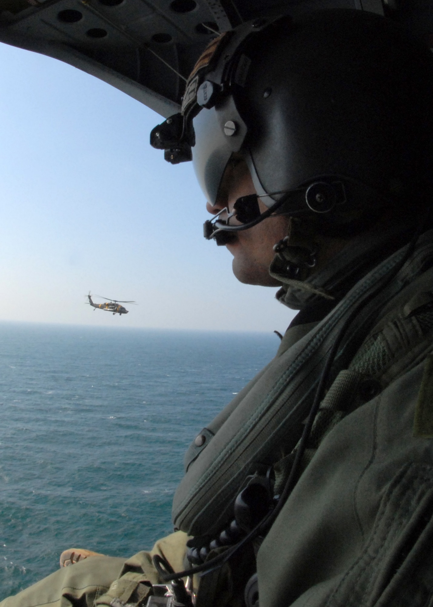 KUNSAN AIR BASE, South Korea -- Sergeant First Class Alexander Pedraza, flight engineer attached to Bravo Company 4-2 from Camp Humphreys looks over the water here Mar. 6.  Bravo Company, 4-2 Attack Battalion, 2nd Combat Aviation Brigade, is enhancing its primary mission of assisting the Naval Component Command, a combined United States and Republic of Korea element with a mission to suppress maritime targets.
(U.S. Air Force Photo/Staff Sgt Araceli Alarcon) 
