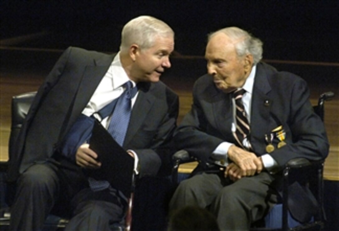 Defense Secretary Robert M. Gates, left, talks with Frank Buckles, 107, one of the last known living World War I veterans during a Pentagon ceremony March 6, 2008. Buckles was honored during the ceremony, which included unveiling an exhibit of veterans' portraits by photographer David DeJonge.