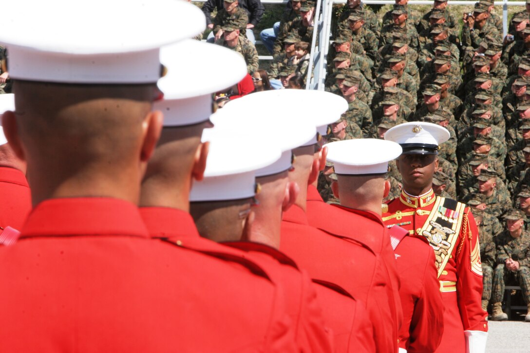 Master Gunnery Sgt. Mark S. Miller conducts the more than 80 musicians that make up the U.S. Marine Drum and Bugle Corps. The Drum and Bugle Corps is the only active unit of its kind throughout the U.S. Armed Forces.::r::::n::