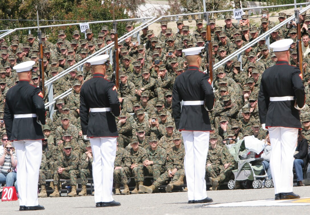 Members of the 24-man Silent Drill Platoon, Marine Barracks Washington stand in from of School of Infantry Marines on Camp Pendleton. Their hour-long ceremony celebrates the pride, professionalism and esprit de corps that are hallmarks of United States Marines and represent all Marines around the globe who embody the core values of honor, courage and commitment.