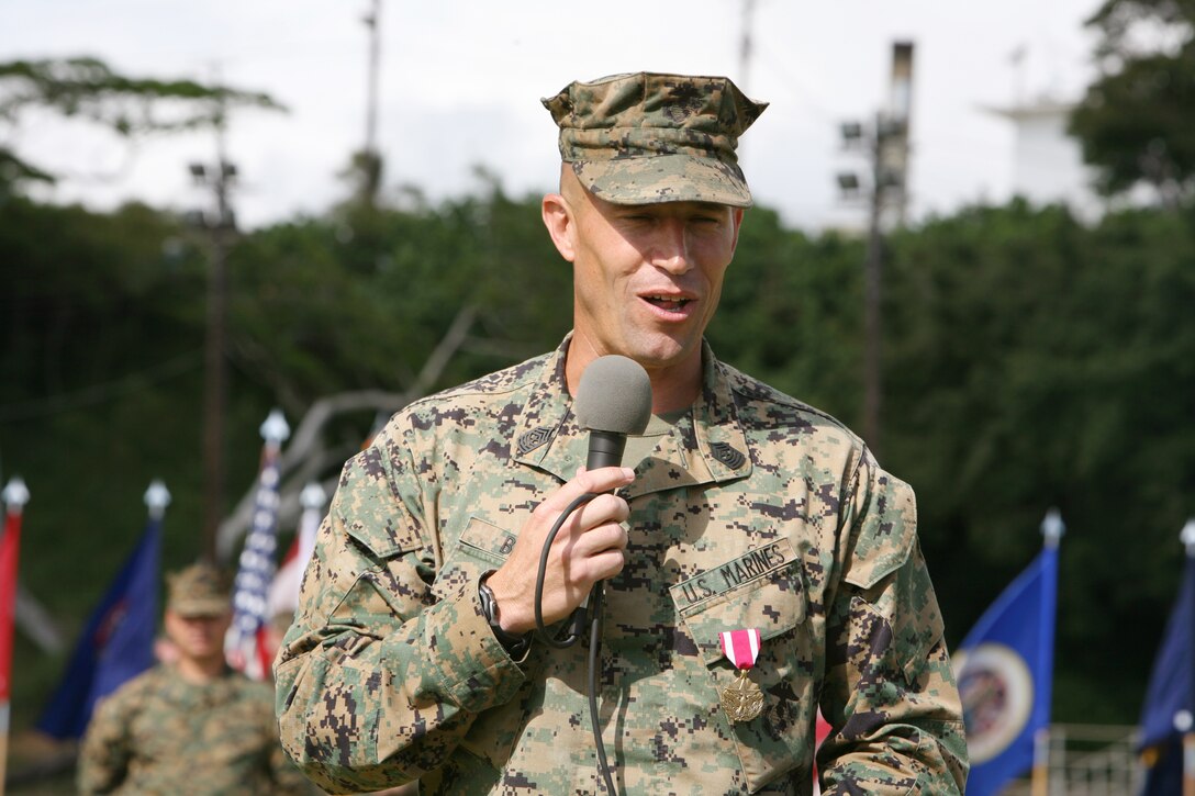 Sergeant Major Michael D. Berg, outgoing battalion sergeant major, Headquarters and Service Battalion, U.S. Marine Corps Forces, Pacific, addresses the audience, after he recieved a Meritorious Service Medal for his service and leadership during a relief and appointment ceremony at Bordelon Field, here March 7.