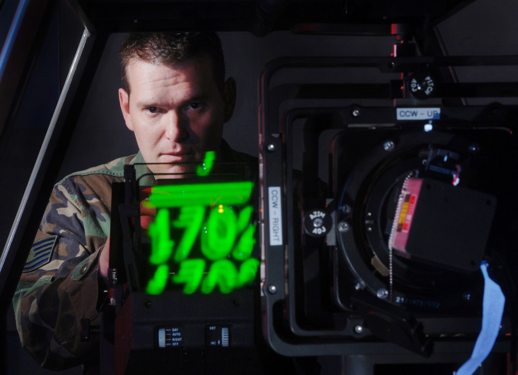 Technical Sgt. James Erickson, an avionics integrated technician from the 452nd Maintenance Squadron, checks the bore sight values of a C-17 Globemaster III cargo aircraft Head-Up Display (HUD) display unit being tested on a Display Unit Test Set (DUTS) at March Air Reserve Base, Calif. Avionics technicians install, maintain and repair electronic and electrical systems on all types of aircraft and they also maintain a high degree of readiness here to deploy worldwide to support wartime and contingency operations, and operations other than war in support of national interests and objectives. (U.S. Air Force photo by Val Gempis)