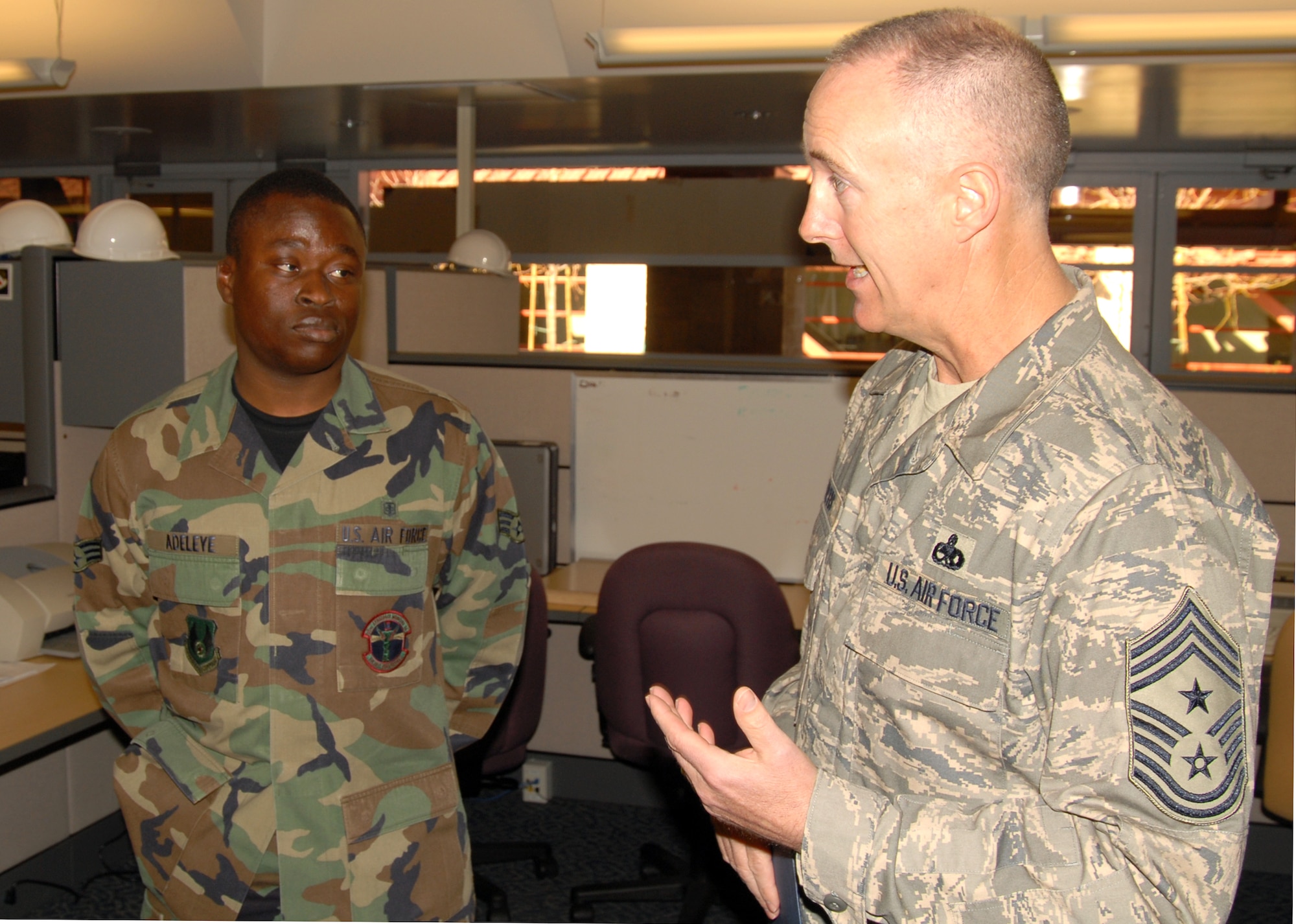 Chief Master Sgt. Kevin Soltis (right), 412th Test Wing command chief, talks about the Dare to Soar award with Senior Airman Alexander Adeleye, 95th Aerospace Medical Squadron bioenvironmental engineer. The Dare to Soar award is presented by the Chief's Group for outstanding performance. Airman Adeleye received the award for volunteering in various Edwards events. (Air Force photo by Airman 1st Class William O’Brien) 