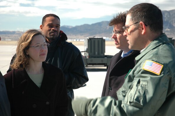 Tech Sgt. Paul H. Martin, 731st Airlift Squadron loadmaster speaks with members from the University of Colorado, Leeds School of Business on March 8 during a tour of the 302nd Airlift Wing at Peterson Air Force Base, Colo. The 50 for Colorado group spent the day learning about economic impacts of defense industry and military communities. (US Air Force photo by Maj. James R. Wilson)