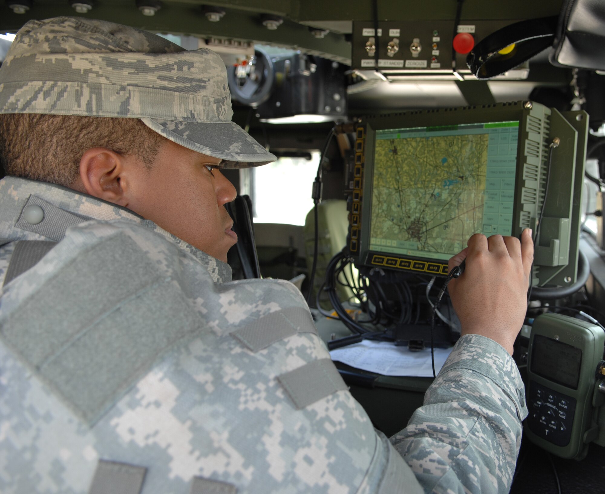 MOODY AIR FORCE BASE, Ga. – Airman 1st Class Jonathan Bourgeois, 822nd
Security Force Squadron radio-telephone operator, performs an operations
check on a Blue Force Tracker during an urban training exercise here March
3. Airmen use advanced tools like the BFT to maintain contact with friendly
forces and reduce battlefield confusion. (U.S. Air Force photo by Senior
Airman Angelita Lawrence)
