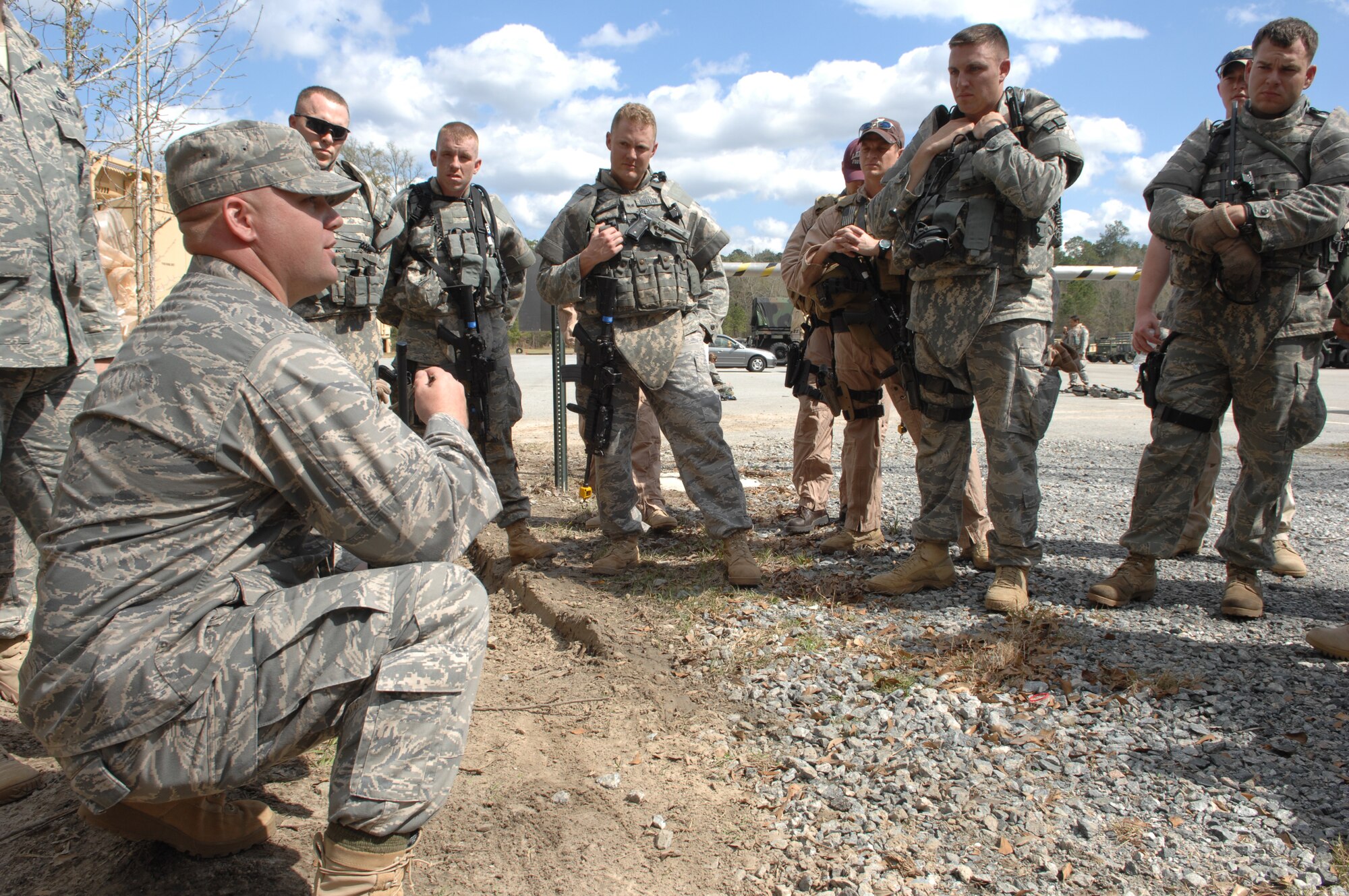 MOODY AIR FORCE BASE, Ga. – Maj. Jason Beers, 822nd Security Force Squadron
commander, provides an after-action review with the squad and fire team
leaders here March 3.  After-action reviews allow each member of a team to
examine errors and suggest improvements. (U.S. Air Force photo by Senior
Airman Angelita Lawrence)

