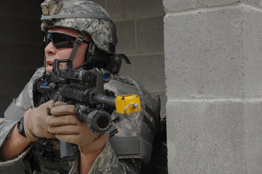 MOODY AIR FORCE BASE, Ga. – Staff Sgt. Adam Vaughan, 822nd Security Forces Squadron squad leader, orders Airmen to move into a building during urban combat training here March 3. Airmen train constantly in a variety of tactics to better prepare themselves for upcoming deployments.(U.S. Air Force photo by Senior Airman Angelita Lawrence) 
