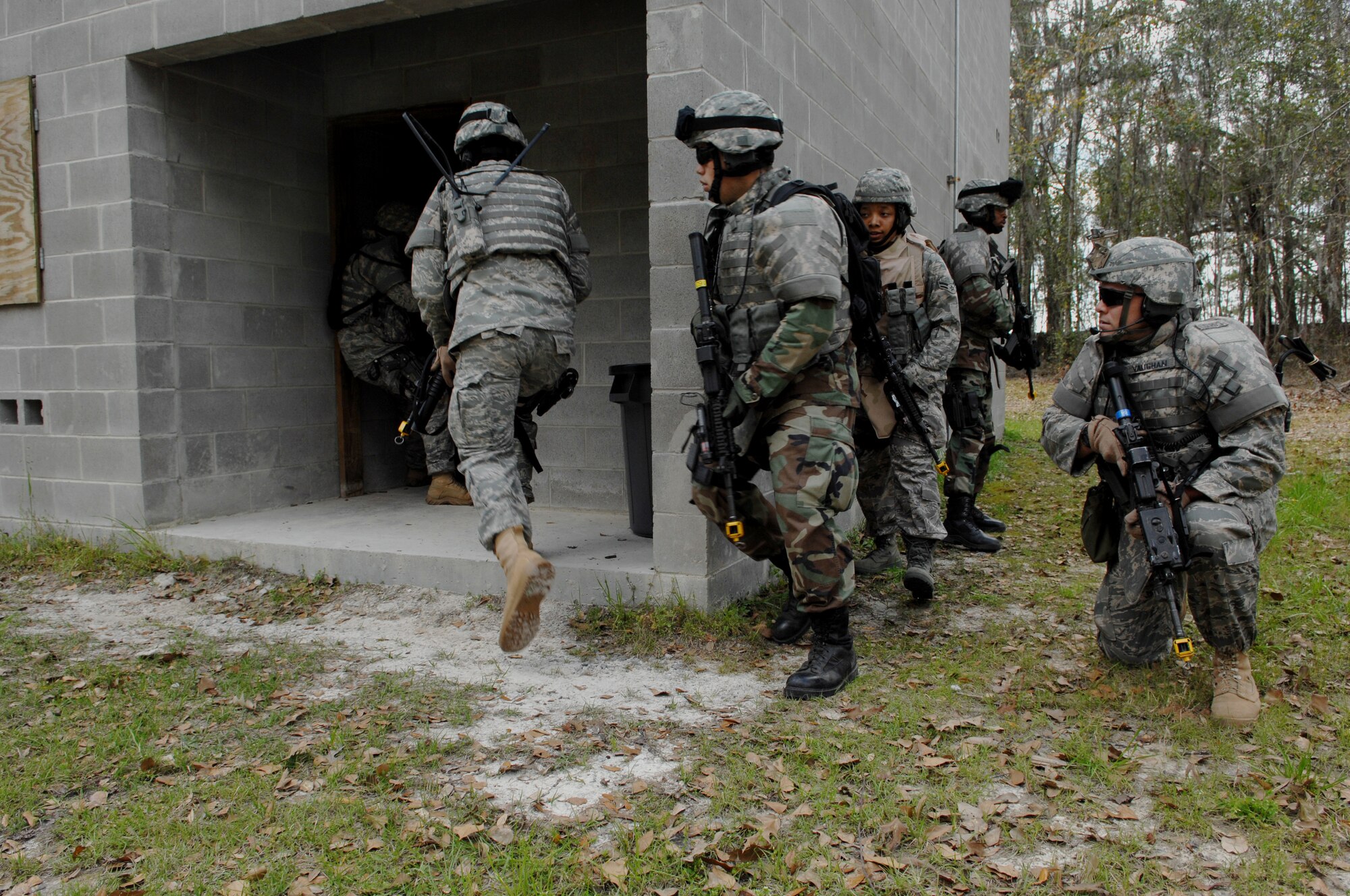 MOODY AIR FORCE BASE, Ga. – Members of the 822nd Security Forces Squadron
assault a building during an exercise at Moody's military operations In
urban terrain village March 3.  Moody's MOUT is capable of recreating
life-like urban scenarios to better train Airmen for deployments. (U.S. Air
Force photo by Senior Airman Angelita Lawrence)
