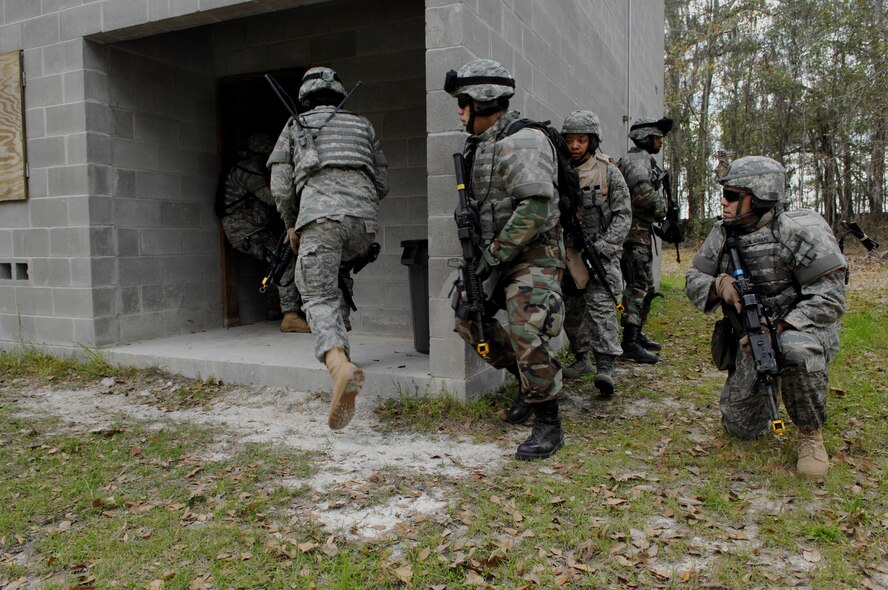 MOODY AIR FORCE BASE, Ga. – Members of the 822nd Security Forces Squadron
assault a building during an exercise at Moody's military operations In
urban terrain village March 3.  Moody's MOUT is capable of recreating
life-like urban scenarios to better train Airmen for deployments. (U.S. Air
Force photo by Senior Airman Angelita Lawrence)

