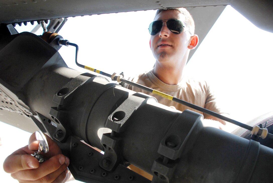 SOTO CANO AIR BASE, Honduras--Army Spec. James Bilton, 1-228th Aviation Battalion Alpha Company crew chief, uses a mirror to inspect a drag beam for corrosion on a UH-60 Blackhawk helicopter main landing gear at Soto Cano Air Base, Honduras. As the aviation function of Joint Task Force-Bravo, 1-228th Aviation Battalion conducts general support aviation operations in support JTF-Bravo and USSOUTHCOM. (U.S. Air Force photo by Tech. Sgt. William Farrow)