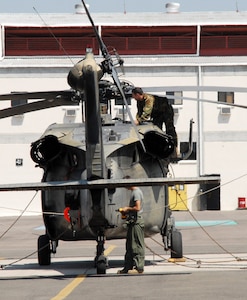 SOTO CANO AIR BASE, Honduras--Maintainers inspecting a UH-60 Blackhawk from 1-228th Aviation Battalion use corrosion prevention identification skills learned while attending a PEO Aviation Corrosion Prevention and Control Center of Excellence education outreach program. More than 30 percent of all Army aircraft phase maintenance is spent correcting corrosion deficiencies. (U.S. Air Force photo by Tech. Sgt. William Farrow) 