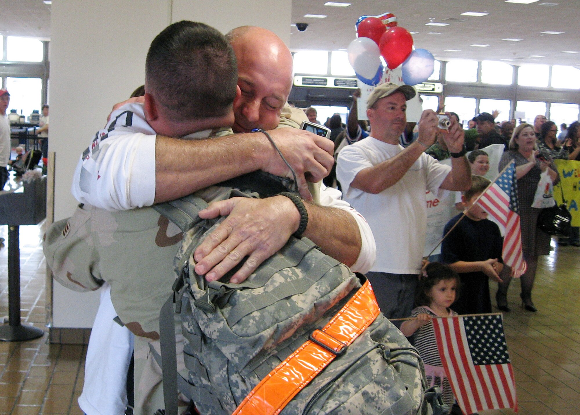 Air Force Reservist Senior Airman Daniel Curtis, 940th Air Refueling Wing Security Forces Squadron, is welcomed home from deployment with a hug March 1, 2008 at the Sacramento International Airport.  Airman Curtis was one of three security forces Airmen deployed for six months to Kirkuk, Iraq, from the 940th ARW at Beale Air Force Base, Calif.  The Reservists were part of the Total Force supporting the Global War on Terror. (U.S. Air Force photo/Maj. Robert Couse-Baker)