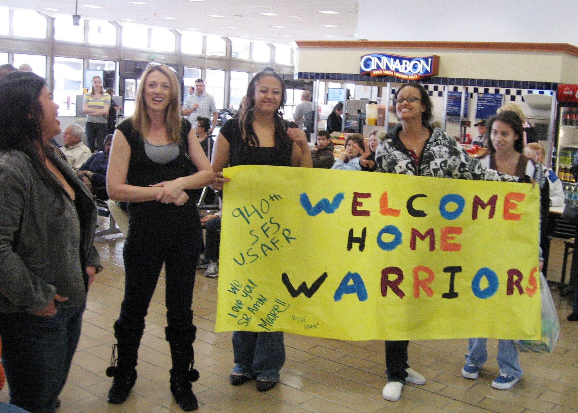 Family members and friends prepare to welcome home three Air Force Reservists from a six month deployment to Kirkuk, Iraq, March 1, 2008 at the Sacramento International Airport. The Airmen, who are from the 940th Air Refueling Wing Security Forces Squadron at Beale Air Force Base, Calif., were part of the Total Force supporting the Global War on Terror. (U.S. Air Force photo/Maj. Robert Couse-Baker)