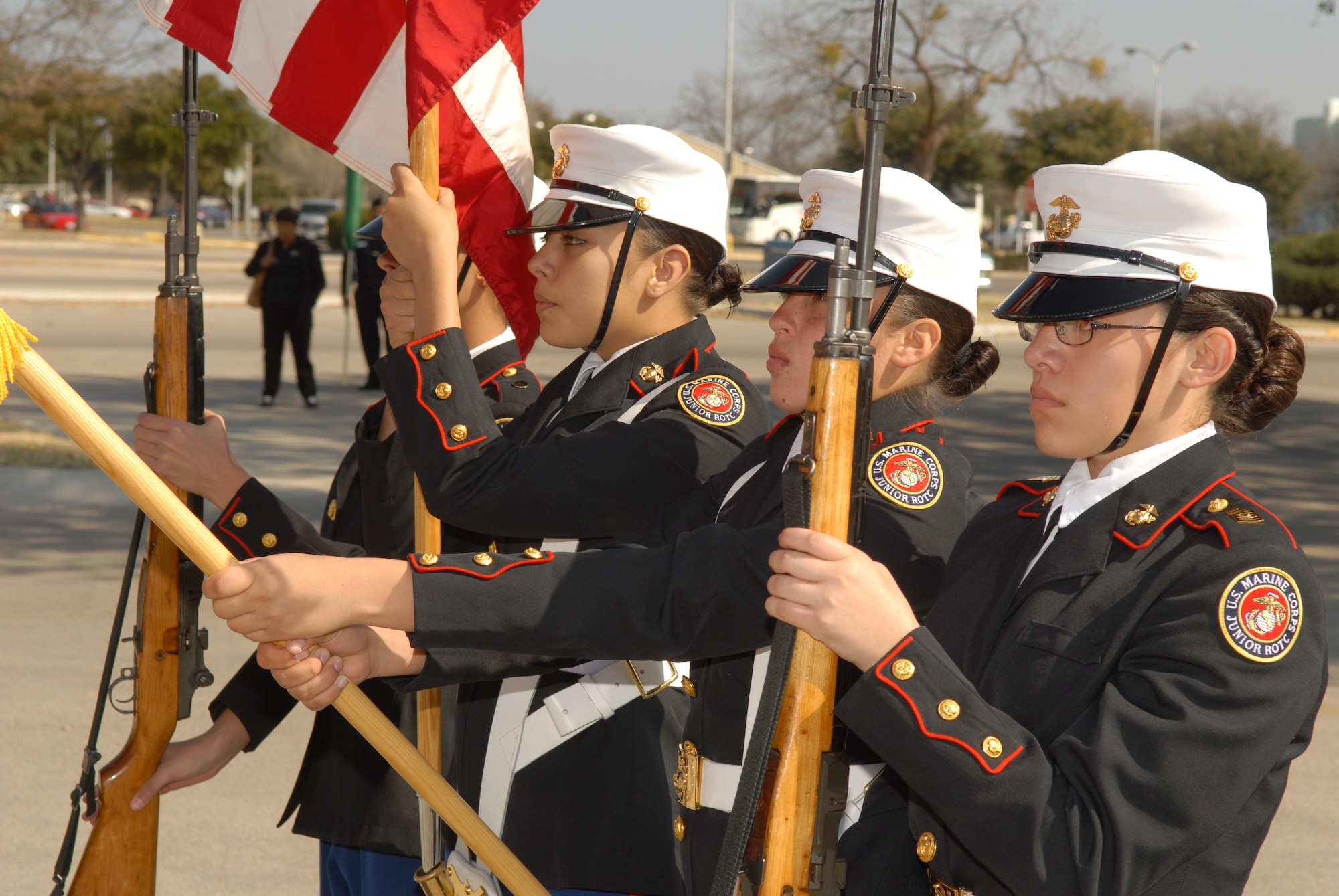 Members of Caprock High School’s female Junior ROTC Marine Color Guard present arms during the color guard portion of the March 2 drill meet. Caprock High School took third place in the color guard category two portion as well as first place in the armed exhibition portion. (U.S. Air Force photo by Staff Sgt. John Barton)