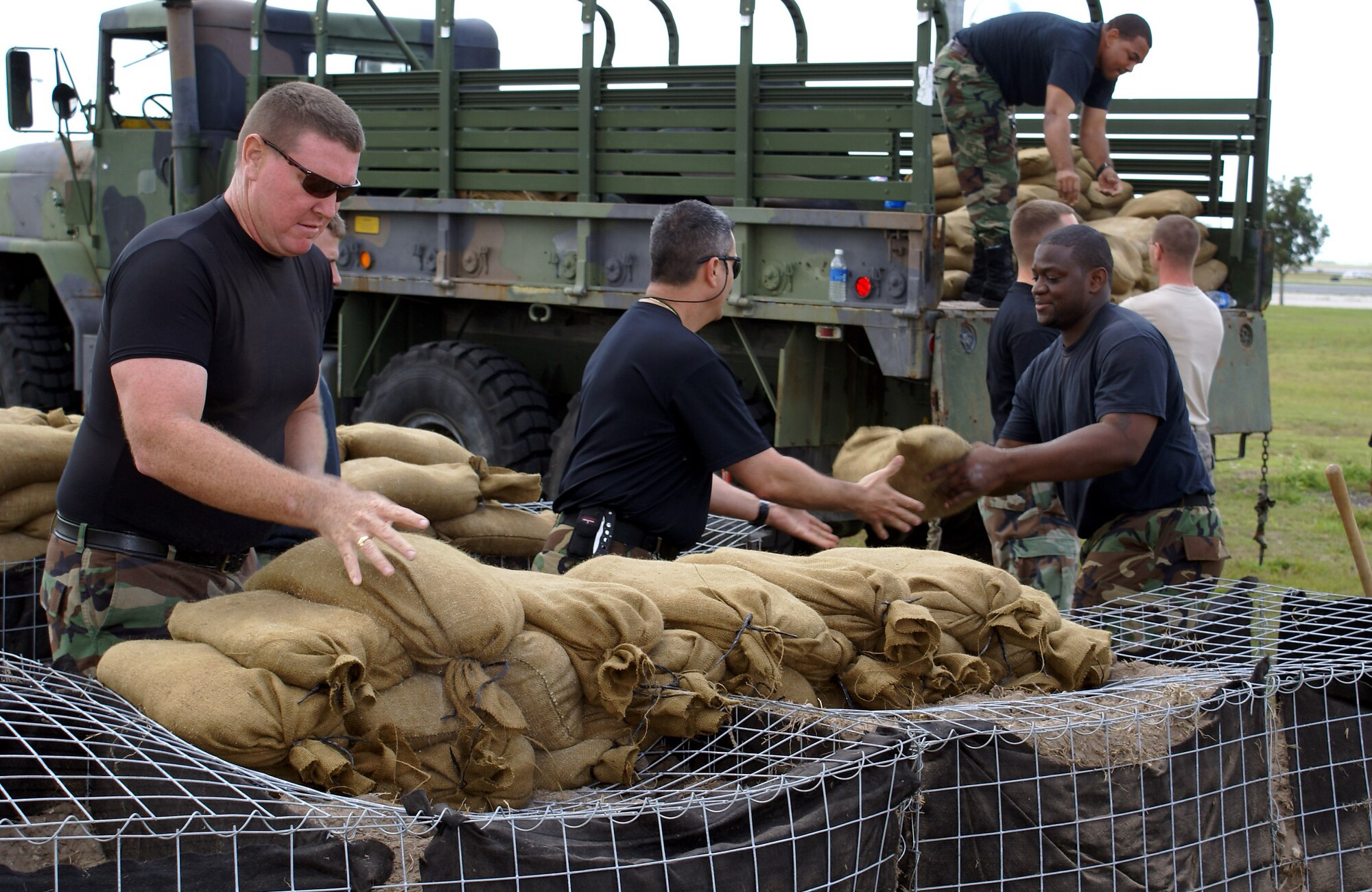 482nd Security Forces Squadron members build a defensive fighting position in preparation for the upcoming Operational Readiness Exercise set for March 8-11 at Homestead Air Reserve Base. An ORE is a self-assessment of the wing’s ability to perform in a simulated combat environment. Explosive devices, smoke grenades and sirens will be used during the exercise to create realistic scenarios that reservists will encounter during the exercise. “Homestead Air Reserve Base goes to great lengths to ensure safety procedures are established and followed during exercises to prepare our reservists for deployment,” said Mr. Sean Quinn, 482nd Mission Support Group Emergency Management Office. (U.S. Air Force photo/Senior Airman Erik Hofmeyer)