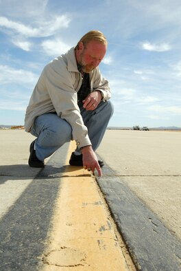 Larry Ledford, 412th Operations Support Squadron airfield manager, received the Air Force Materiel Command Airfield Management Civilian Supervisor of the Year award. Mr. Ledford led 14 military and civilian personnel in maintaining Edwards’ lakebed and airfield complex. He ensured the airfield environment is 100-percent compliant. (Air Force photo by Senior Airman Julius Delos Reyes)