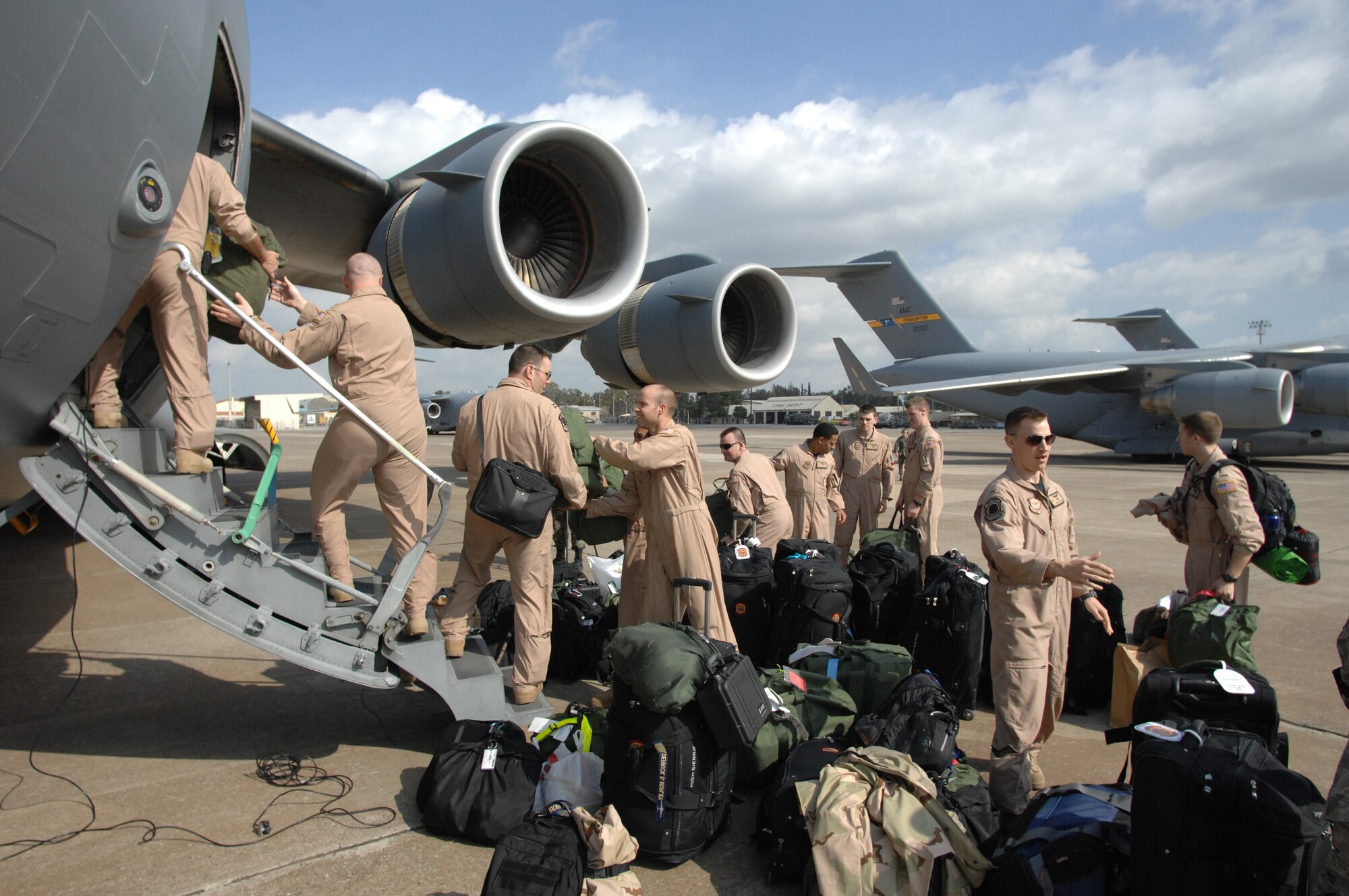 Aircrew members work together to load a C-17 on Incirlik?s Flight line March 4. This was one of the last official uses of the flight line before it shuts down for maintenance March 9.