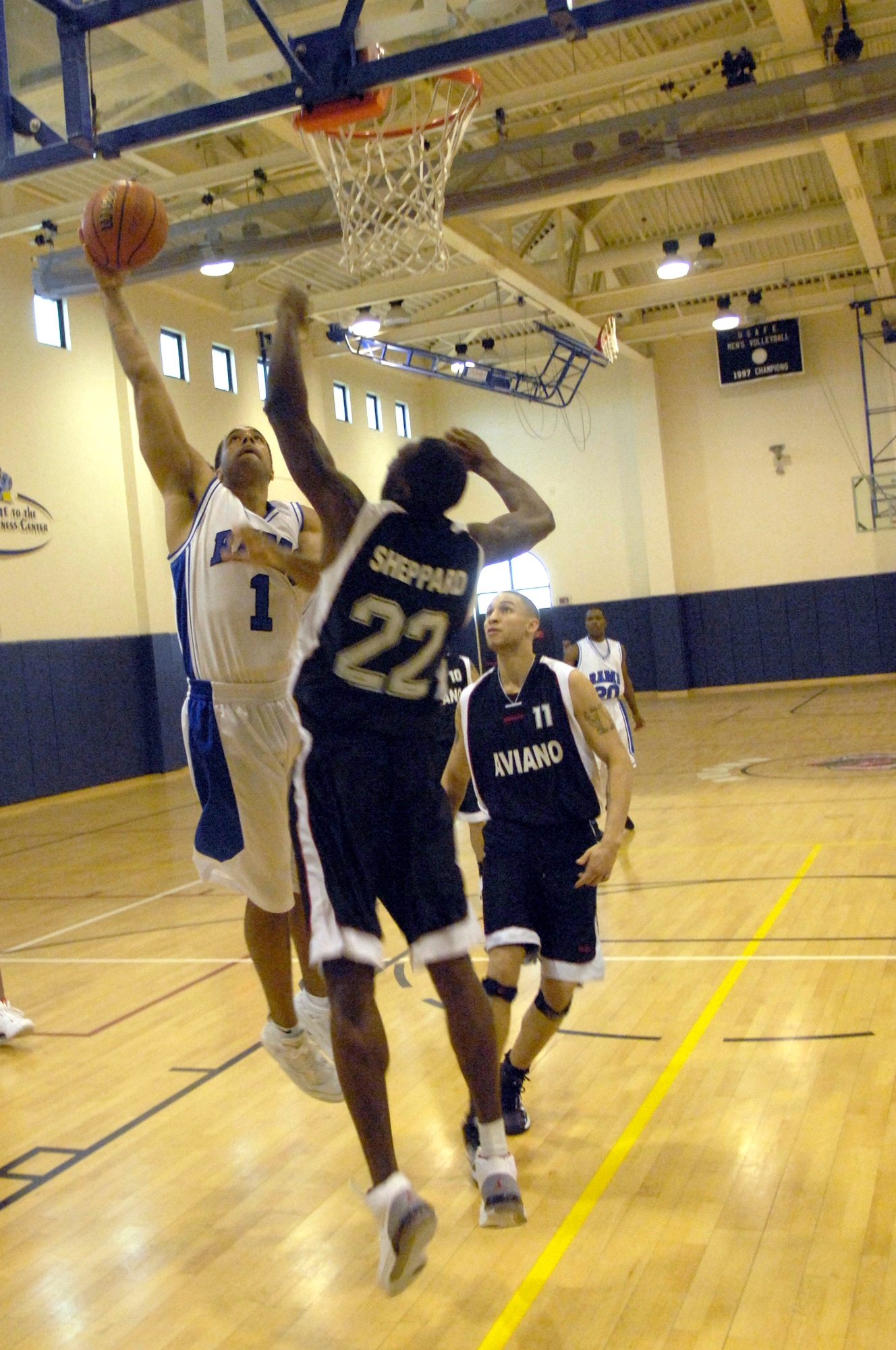 AVIANO AIR BASE, Italy --Kirk Sheppard, 31st Maintenance Squadron, attempts to block a shot by Michael Moody, 723 Air Mobility Squadron, during the 2008 USAFE Basketball Champion Tournament at the Dragon Fitness Center, March 6, 2008.  (U.S. Air Force photo/Senior Airman Michael S. Dorus)