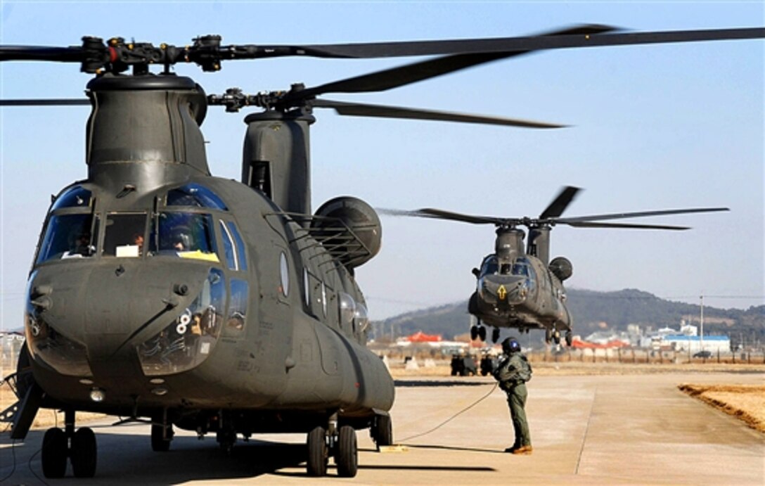 Two CH-47 Chinook helicopters land, Mar. 1, 2008, at Kunsan Air Base, South Korea, as part of the Key Resolve/Foal Eagle Exercise, to enhance combat readiness and joint interoperability. 