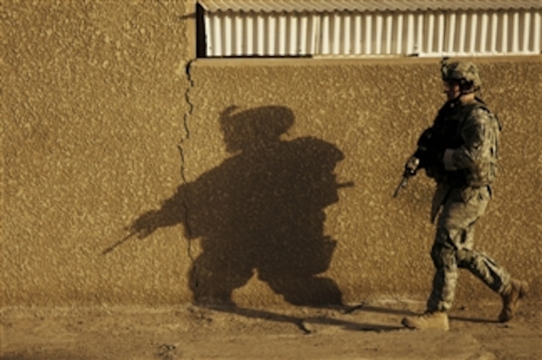 U.S. Army 1st Lt. Alan Boyce from the 1st Battalion, 68th Armor Regiment, 3rd Brigade Combat Team, 4th Infantry Division participates in a dismounted presence patrol through the Beida neighborhood of Baghdad, Iraq, on Feb. 29, 2008.  