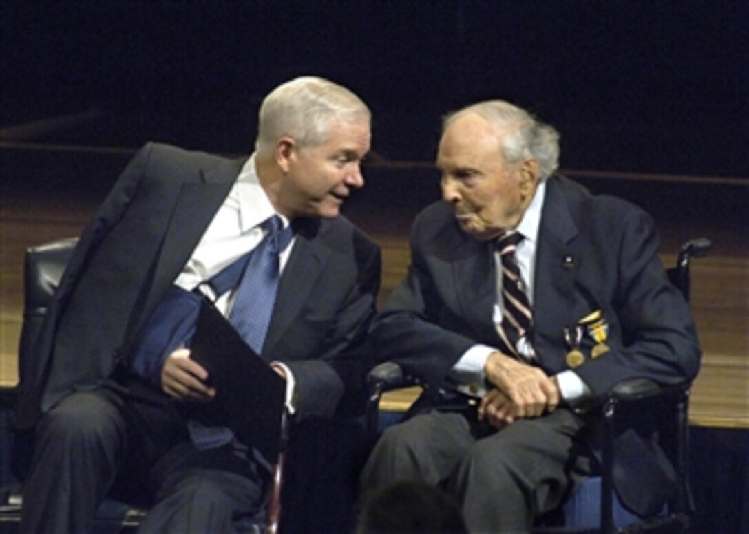Secretary of Defense Robert M. Gates (left) talks with guest of honor 107 year-old Frank Buckles during Pentagon ceremonies unveiling an exhibit of portraits by photographer David DeJonge, of the last nine veterans of WWI on March 6, 2008.  Buckles served as an ambulance driver in WWI after enlisting at age 15.  The only other surviving WWI vet, John Babcock, was unable to attend the ceremony.  