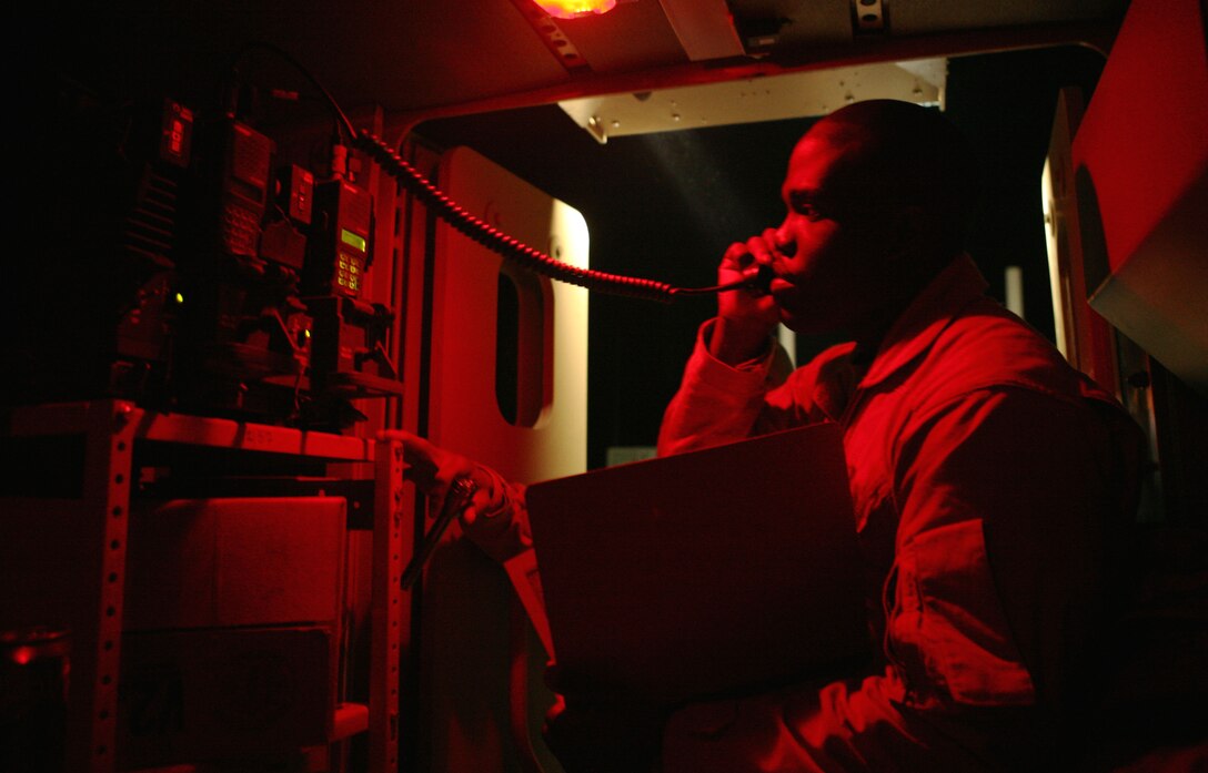 Sgt. Rhee Joyce, a radio operator with Charlie Company, Combat Logistics Battalion 1, 1st Marine Logistics Group, runs a communication test at Camp Fallujah before an early morning mission Mar. 7. The company of Marine combat engineers provided logistics and personnel support to service members at Forward Operating Base Hawas, swapping out a generator and dropping off five specialized utility Marines to operate the FOB's water purification system. The company also retrieved a downed Humvee before dawn. Combat engineers continue to provide support by emplacing force-protection barriers, building safe structures and repairing damaged roads, but they're also starting to demilitarize surrounding communities as Al Anbar province becomes more stable.