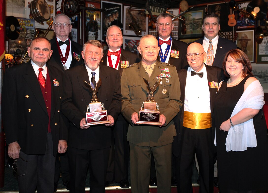 Retired Navy Chief Petty Officer Randy Reichler and Lt. Gen. Dennis J. Hejlik, II Marine Expeditionary Force commanding general, second from left and center in the front row, pose with members of the Non Commissioned Officers Association after receiving the Sergeant Major C. A. “Mack” McKinney Award from the Non Commissioned Officers Association, Jan. 22, 2010.  The award is presented by the Down East Chapter of the Non Commissioned Officers Association to military members who have demonstrated professionalism, dedication and service to the United States and its military over a sustained period of time, and to members of the local community who have demonstrated a strong support for the military community.