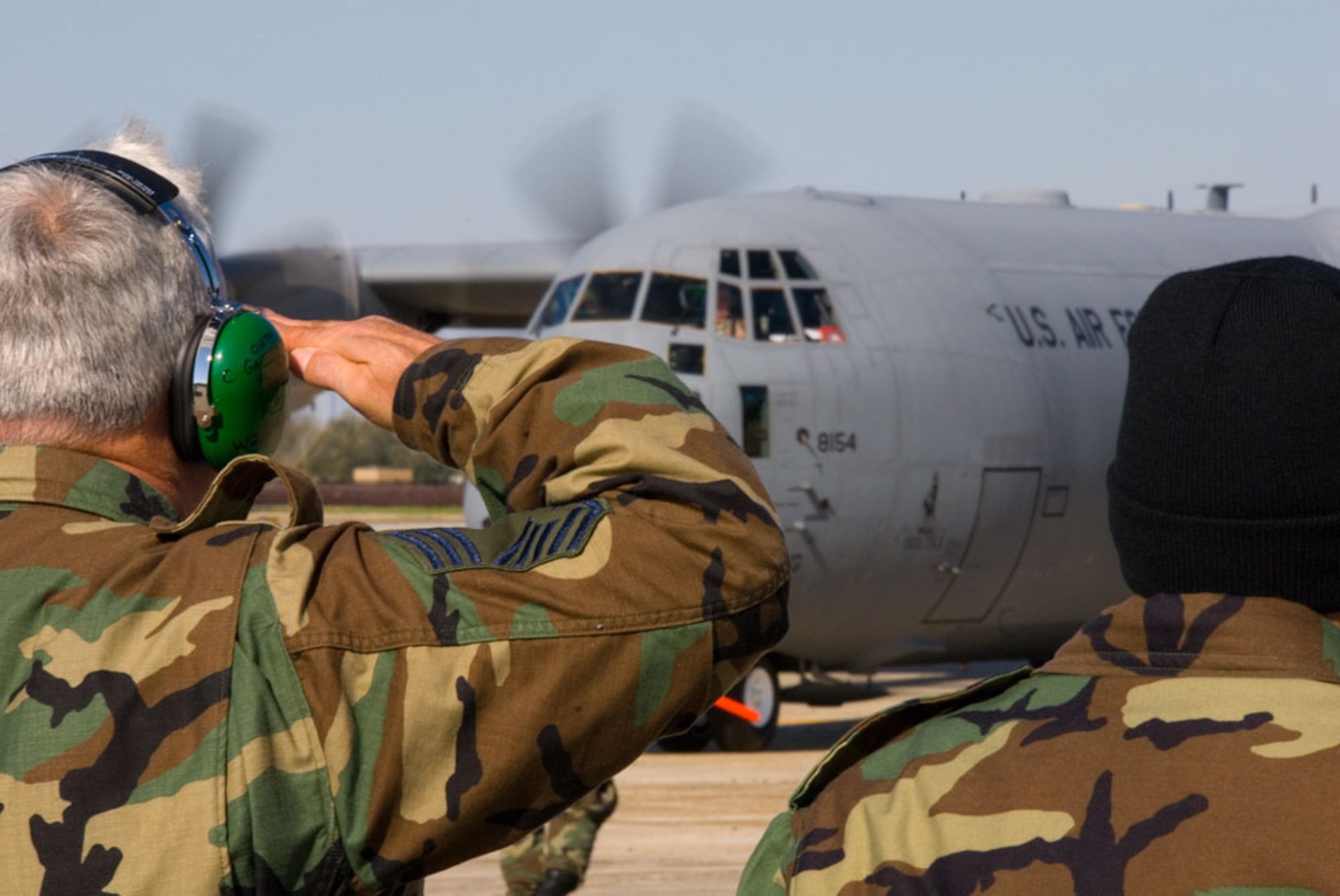 KEESLER AIR FORCE BASE, Miss.--Maintaintainers salute fellow members of the 403rd Wing who are aboard the "Spirit of Bilioxi" a C-130J-30 headed for Southwest Aisa. The aircraft was dedicated to the city of Biloxi in 2006. As the troops begin their mission in support of the Global War on Terror, the noseart on this aircraft symbolizes the bond between the community and the  Citizen Airmen. (U.S. Air Force Photo/Tech. Sgt. James B. Pritchett)