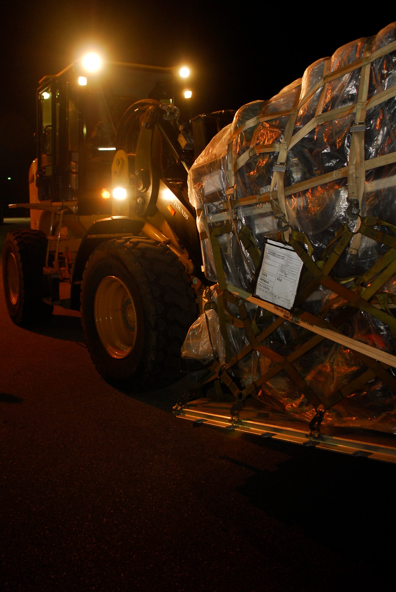 An 18th Wing Shogun uses a forklift to transport a pallet during the 2008 Pacific Air Forces Operational Readiness Inspection at Kadena Air Base, Japan, March 10, 2008. PACAF is conducting the inspection from March 9 to 15 to validate the mission readiness of the 18th Wing. (U.S. Air Force photo/Staff Sgt. Joshua Garcia)