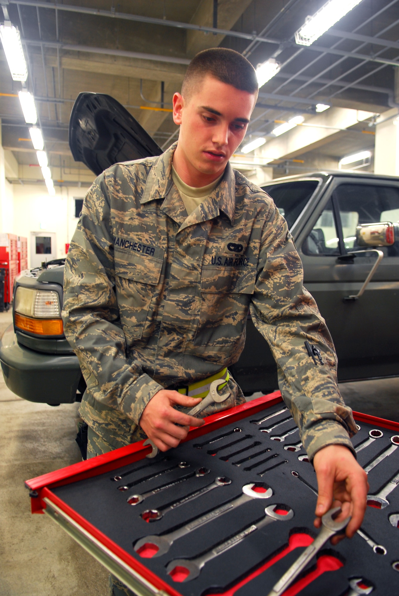 Airman 1st Class Derek Manchester, 18th Logistics Readiness Squadron, puts tools away after performing maintenance on a vehicle during the 2008 Pacific Air Forces Operational Readiness Inspection at Kadena Air Base, Japan, March 11, 2008. PACAF is conducting the inspection from March 9 to 15 to validate the mission readiness of the 18th Wing. (U.S. Air Force photo/Staff Sgt. Joshua J. Garcia) 