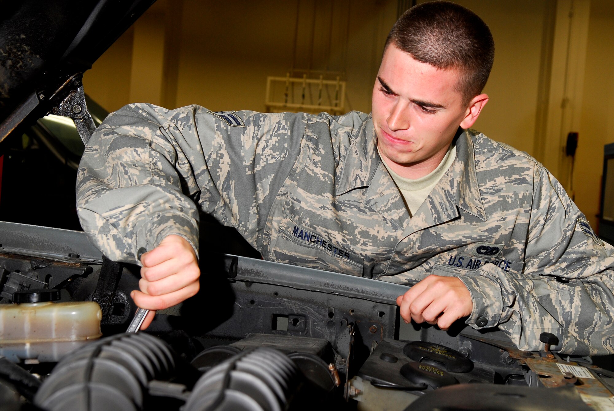 Airman 1st Class Derek Manchester, 18th Logistics Readiness Squadron, tightens the front brake line on a vehicle during the 2008 Pacific Air Forces Operational Readiness Inspection at Kadena Air Base, Japan, March 11, 2008. PACAF conducted the inspection from March 9 to 15 to validate mission readiness of the 18th Wing. (U.S. Air Force photo/Staff Sgt. Joshua J. Garcia) (Released)