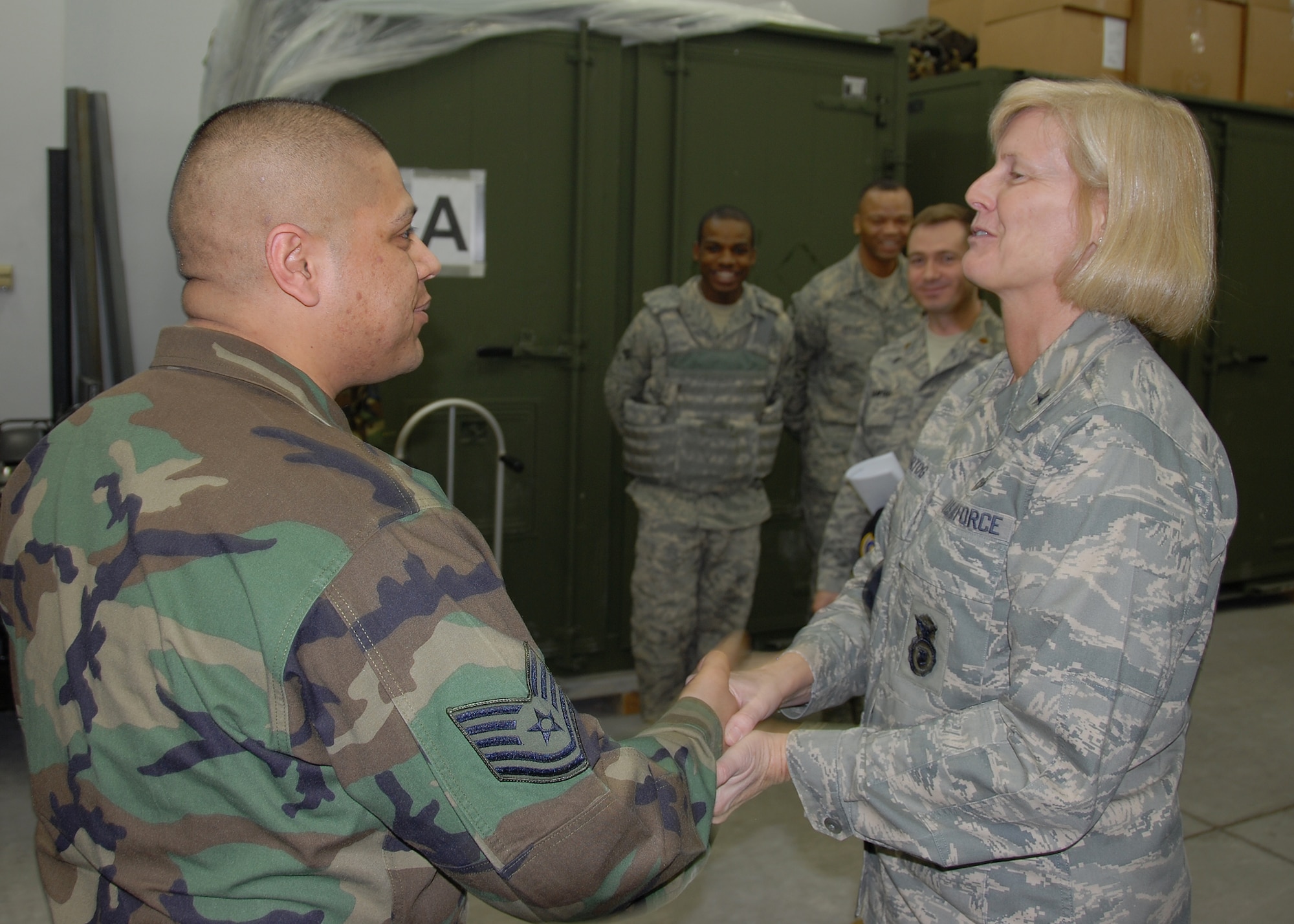 MISAWA AIR BASE, Japan -- Brig. Gen. Mary Kay Hertog, Director of Security Forces, greets Tech. Sgt. Alfonso Patague, 35th Security Forces Squadron, during her visit to Misawa Feb. 29. General Hertog said that one of her priorities is getting out and talking to Airmen face-to-face. (U.S. Air Force photo by Senior Airman Chad Strohmeyer)