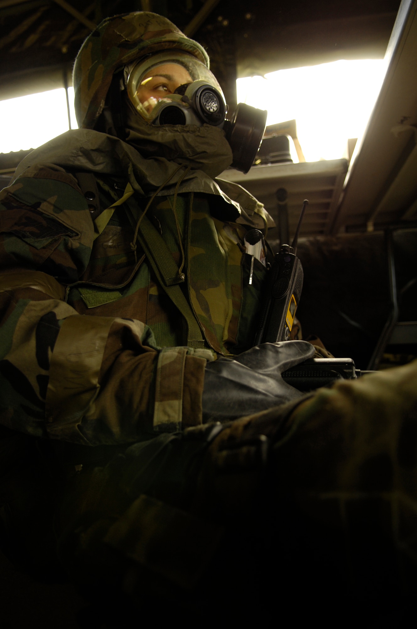 VANDENBERG AIR FORCE BASE, Calif.-- 1st Lt. Andrea Taylor, 30th Space Communications Squadron, waits out a mock chemical attack here March 6 during a North Star exercise.  The exercise is a military resource in the Global War on Terrorism.  Airmen engaged in defending, securing terrain and training to be better prepared for deployed base operations. (U.S. Air Force photo/Senior Airman Cole Presley)
