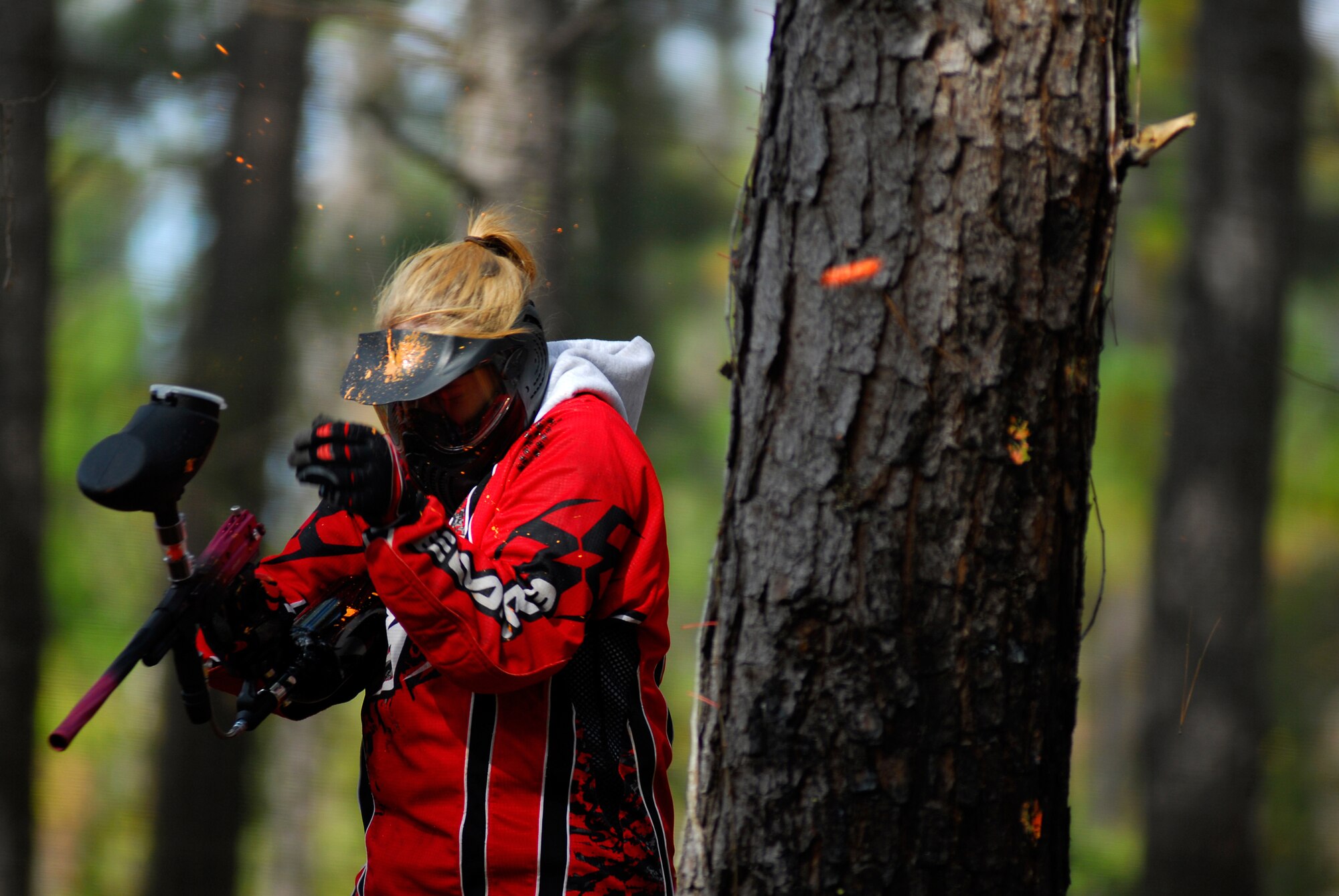 MOODY AIR FORCE BASE, Ga. -- Senior Airman Gina Chiaverotti, 23rd Wing Public Affairs photographer, takes a paintball to the head during a game at Moody's Splatter Swamp paintball range Nov. 17, 2007. A Paintball shooting contest is one of multiple events scheduled for Moody's outdoor extravaganza March 14. (U.S. Air Force photo by Tech. Sgt. Parker Gyokeres)
