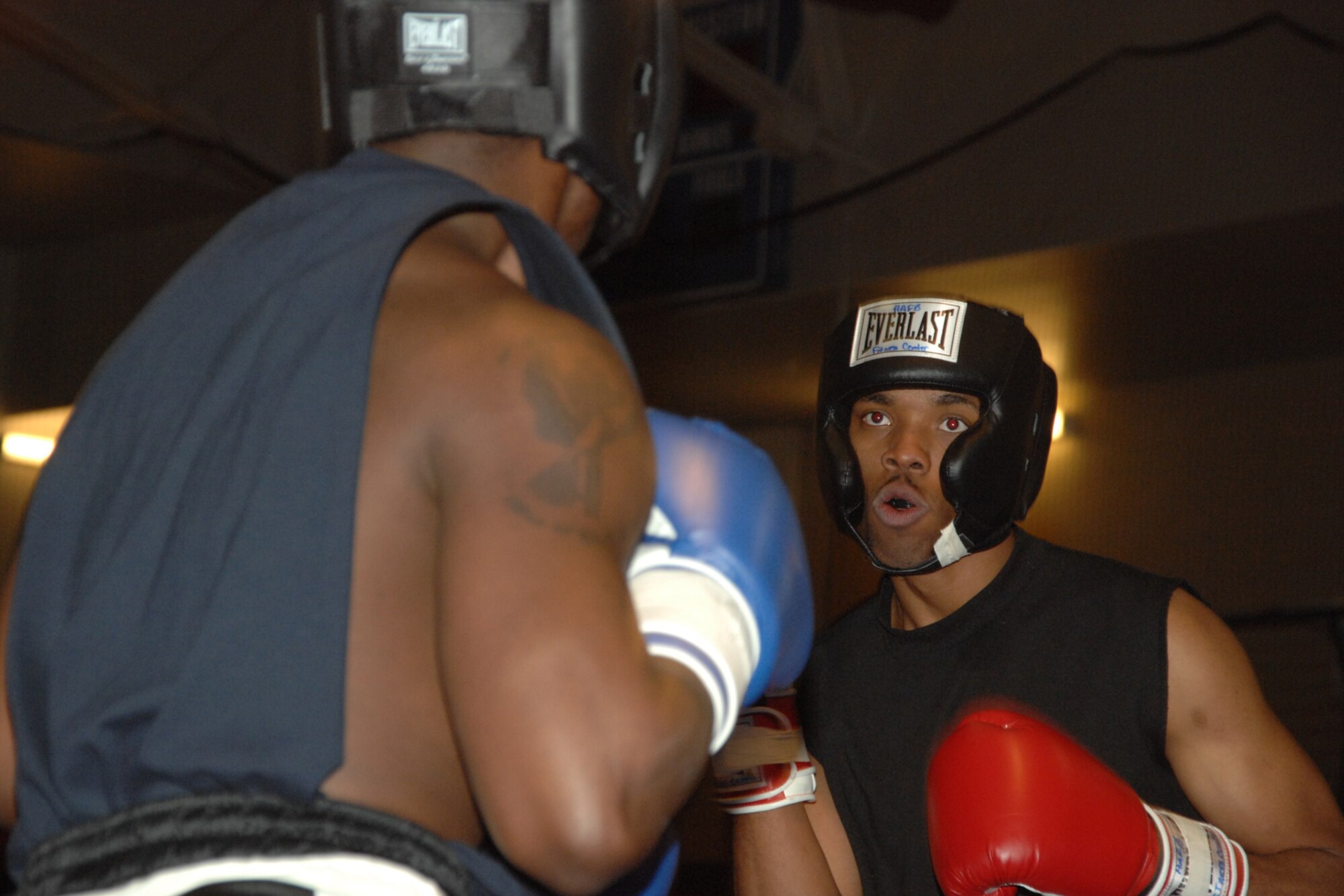 Senior Airman Darius Jones, 49th Operations Support Squadron, stares down his opponent during a Raptor Rumble match March 7 at Holloman Air Force Base, N.M. Challenging him is Airman 1st Class Daniel Monroe, also of 49 OSS. (U.S. Air Force photo/Airman 1st Class Jamal D. Sutter)