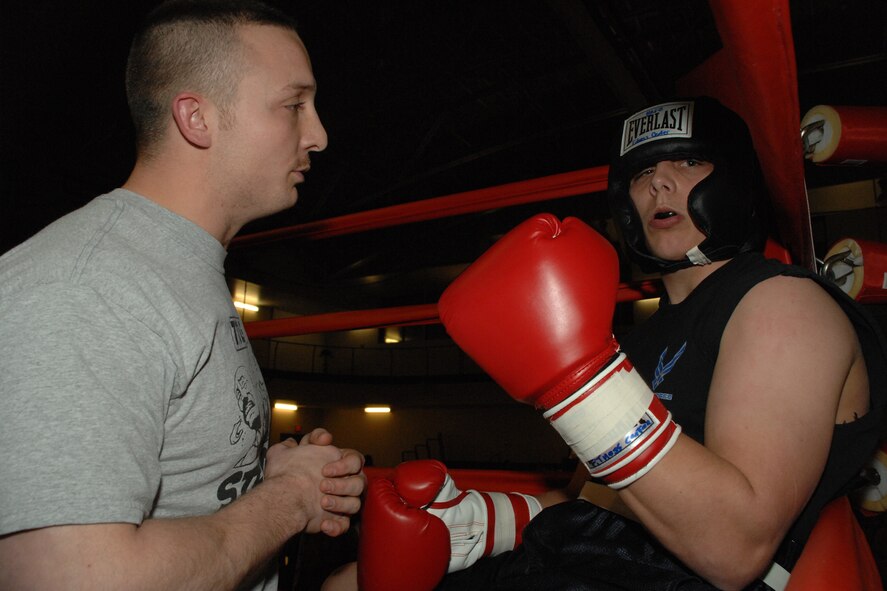 Airman 1st Class Michael Regina, 49th Maintenance Squadron, signals he is good to go after a tough round against Senior Airman Trevor Breen, 49th Operations Support Squadron, March 7 at Holloman Air Force Base, N.M. The two fought in the 165 lb. division. (U.S. Air Force photo/Airman 1st Class Jamal D. Sutter)