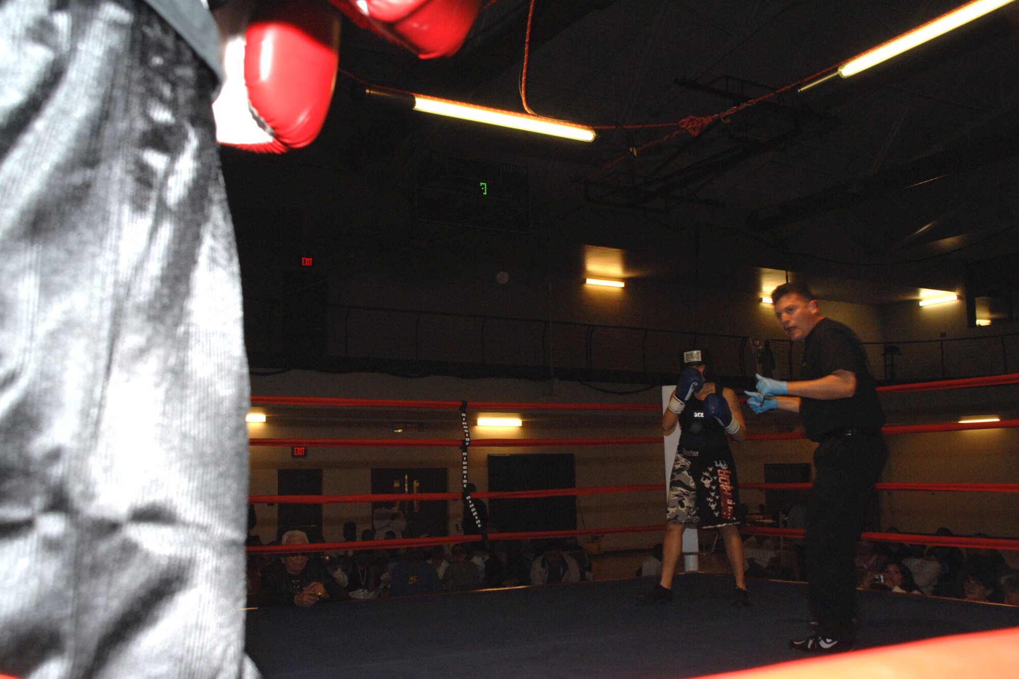 Airman 1st Class Krystal Macatol, 49th Maintenance Squadron, awaits the ringing of the bell to begin her fight against Staff Sgt. Genese Williams, 49th Materiel Maintenance Support Squadron, during a Raptor Rumble match March 7 at Holloman Air Force Base, N.M. The two, who were the only females to box, fought in the 125 lb. division. (U.S. Air Force photo/Airman 1st Class Jamal D. Sutter)