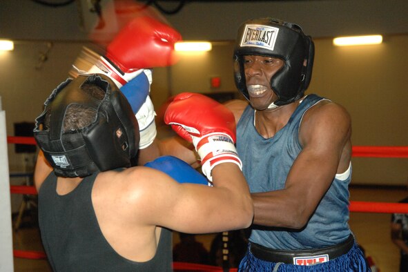 2nd Lt. Brandon Sanders, 49th Civil Engineer Squadron, makes space during his match against Airman 1st Class Willie Bivins, 49th Maintenance Squadron, March 7 at Holloman Air Force Base, N.M. Lieutenant Sanders, who was the only officer to participate in the Raptor Rumble, won the match by decision. (U.S. Air Force photo/Airman 1st Class Jamal D. Sutter)