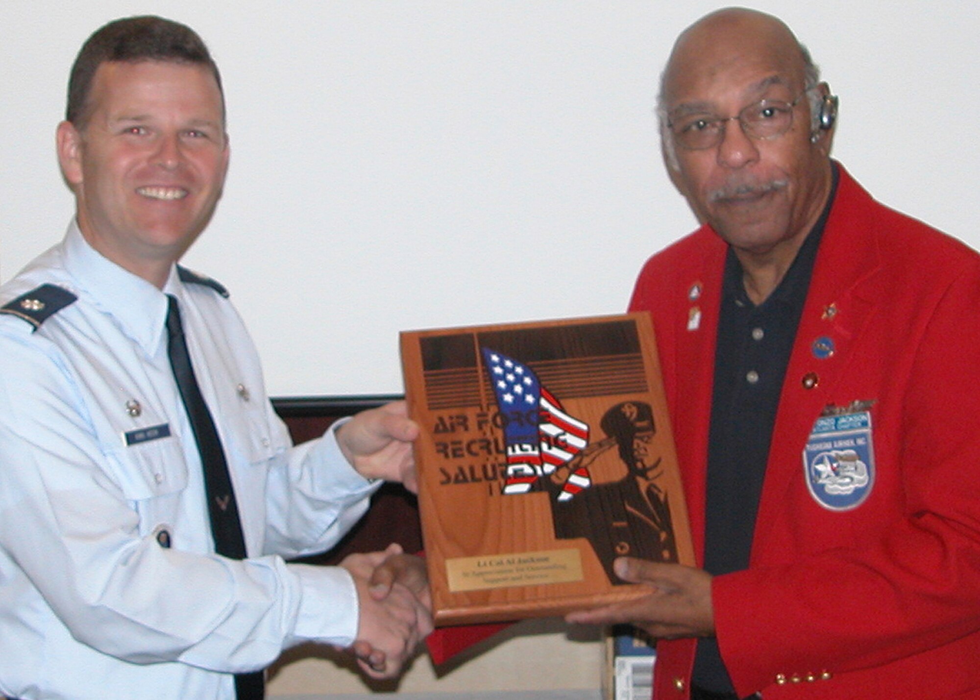 Retired Lt. Col. Alfonzo Jackson is presented the Air Force Recruiting Salutes Award by Lt. Col. Richard Van Hook, 336th Recruiting Squadron commander March 7 in Augusta, Ga., in recognition of the Tuskegee Airman’s outstanding support to Air Force recruiting. (U.S. Air Force photo/Staff Sgt. Joshua Martin)