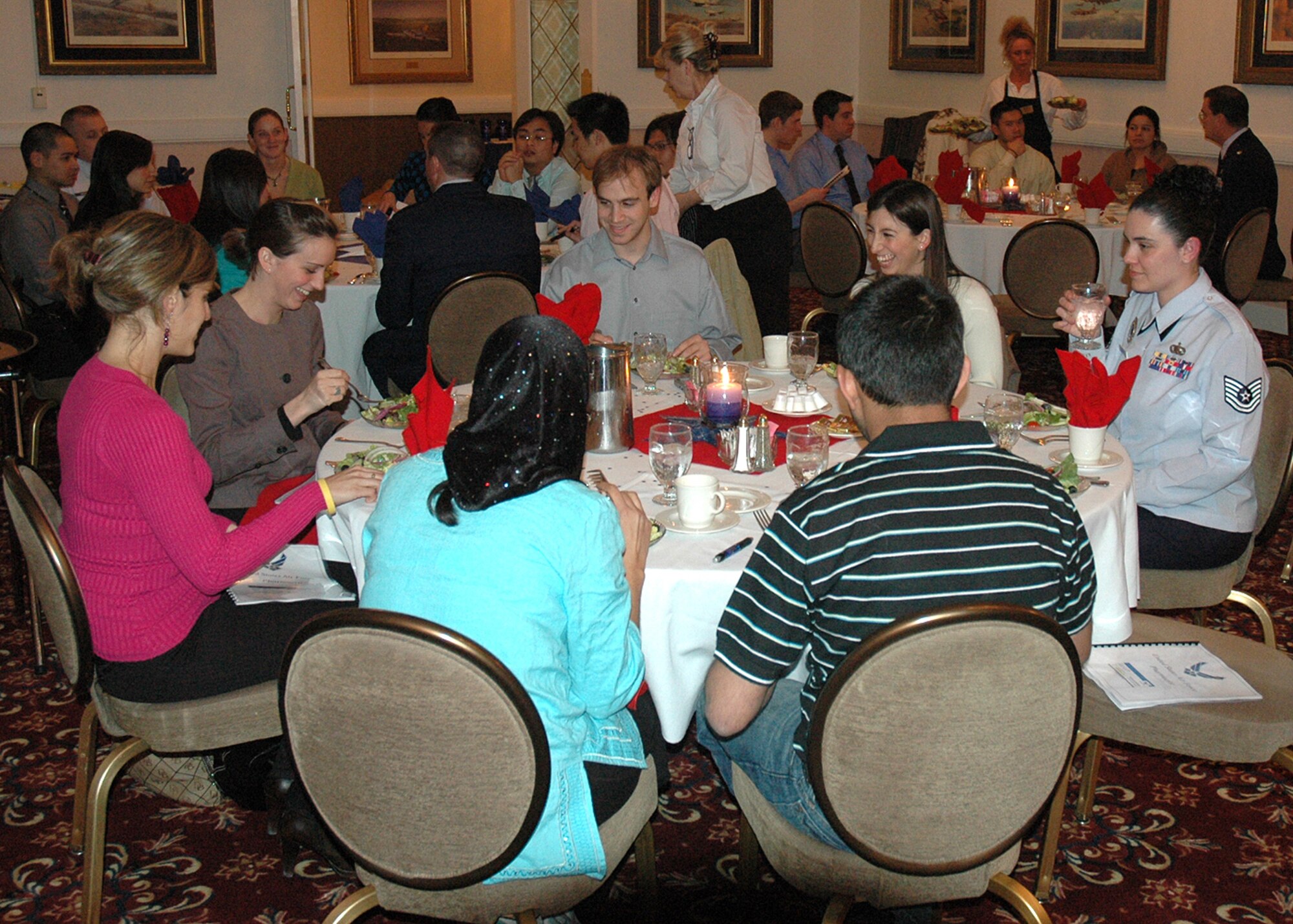 Tech.Sgt. Kim McBride, 319th Recruiting Squadron officer accessions recruiter, speaks to dinner guests about Air Force life during the squadron’s first Pharmacist Orientation Feb. 26 at Hanscom Air Force Base, Mass. (U.S. Air Force photo/Master Sgt. Robert Barrett)