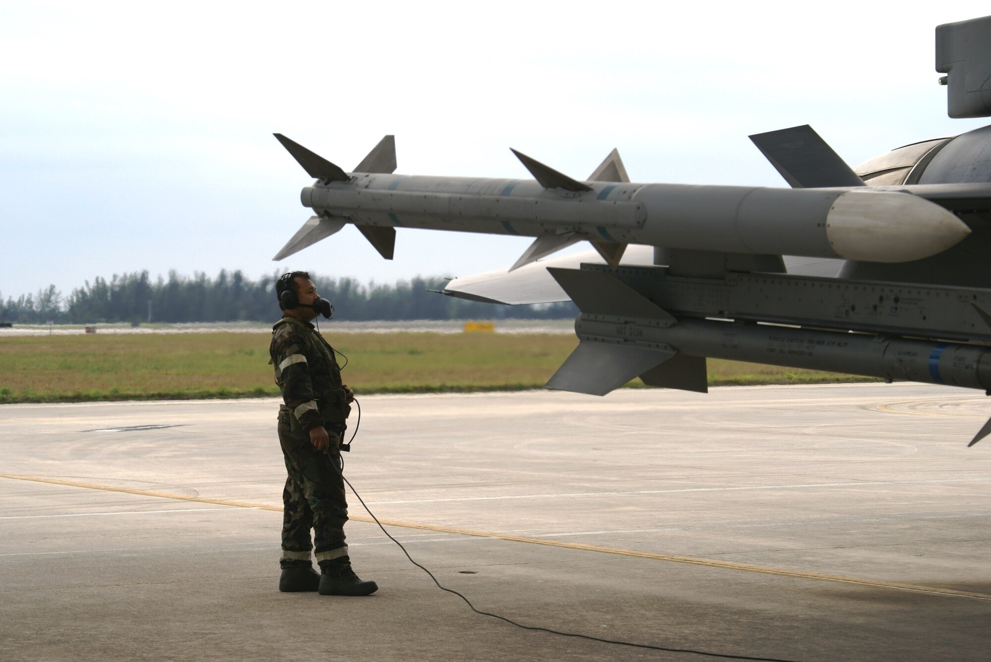 Tech. Sgt. Juan Guerra, 482nd Aircraft Maintenance Squadron, conducts pre-flight inspections of an F-16 during Operation Deliberate Tropic, Homestead Air Reserve Base, March 10, 2008.  The Operational Readiness Exercise is a self-assessment of the wing’s ability to perform in a simulated combat environment. Explosive devices, smoke grenades and sirens will be used during the exercise to create realistic scenarios that reservists will encounter during the exercise. “Homestead Air Reserve Base goes to great lengths to ensure safety procedures are established and followed during exercises to prepare our reservists for deployment,” said Mr. Sean Quinn, 482nd Mission Support Group Emergency Management Office. (U.S. Air Force photo/Tim Norton)