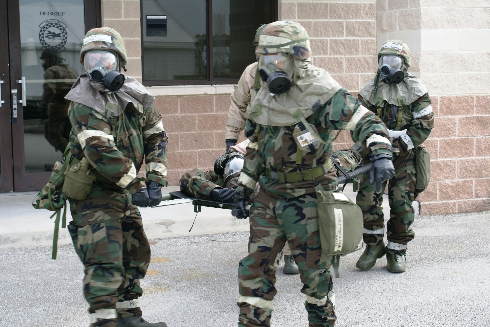 Members from the 482nd Maintenance Squadron, transport an injured member to the casualty collection point after a simulated attack during Operation Deliberate Tropic, Homestead Air Reserve Base, March 10, 2008.  The Operational Readiness Exercise is a self-assessment of the wing’s ability to perform in a simulated combat environment. Explosive devices, smoke grenades and sirens will be used during the exercise to create realistic scenarios that reservists will encounter during the exercise. “Homestead Air Reserve Base goes to great lengths to ensure safety procedures are established and followed during exercises to prepare our reservists for deployment,” said Mr. Sean Quinn, 482nd Mission Support Group Emergency Management Office. (U.S. Air Force photo/Tim Norton)
