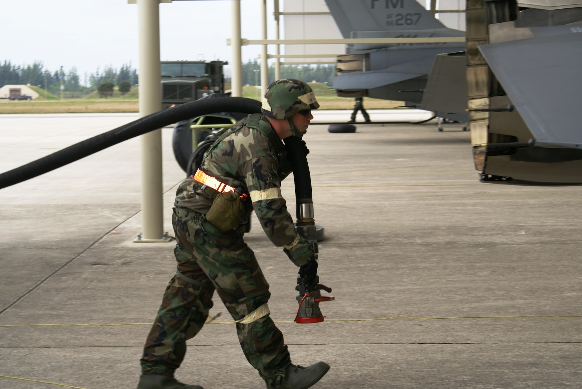 Senior Airman William Kuykendall, 482nd Logistics Readiness Squadron, prepares to refuel an F-16 after returning from a training mission during Operation Deliberate Tropic, Homestead Air Reserve Base, March 10, 2008.  The Operational Readiness Exercise is a self-assessment of the wing’s ability to perform in a simulated combat environment. Explosive devices, smoke grenades and sirens will be used during the exercise to create realistic scenarios that reservists will encounter during the exercise. “Homestead Air Reserve Base goes to great lengths to ensure safety procedures are established and followed during exercises to prepare our reservists for deployment,” said Mr. Sean Quinn, 482nd Mission Support Group Emergency Management Office. (U.S. Air Force photo/Tim Norton)
