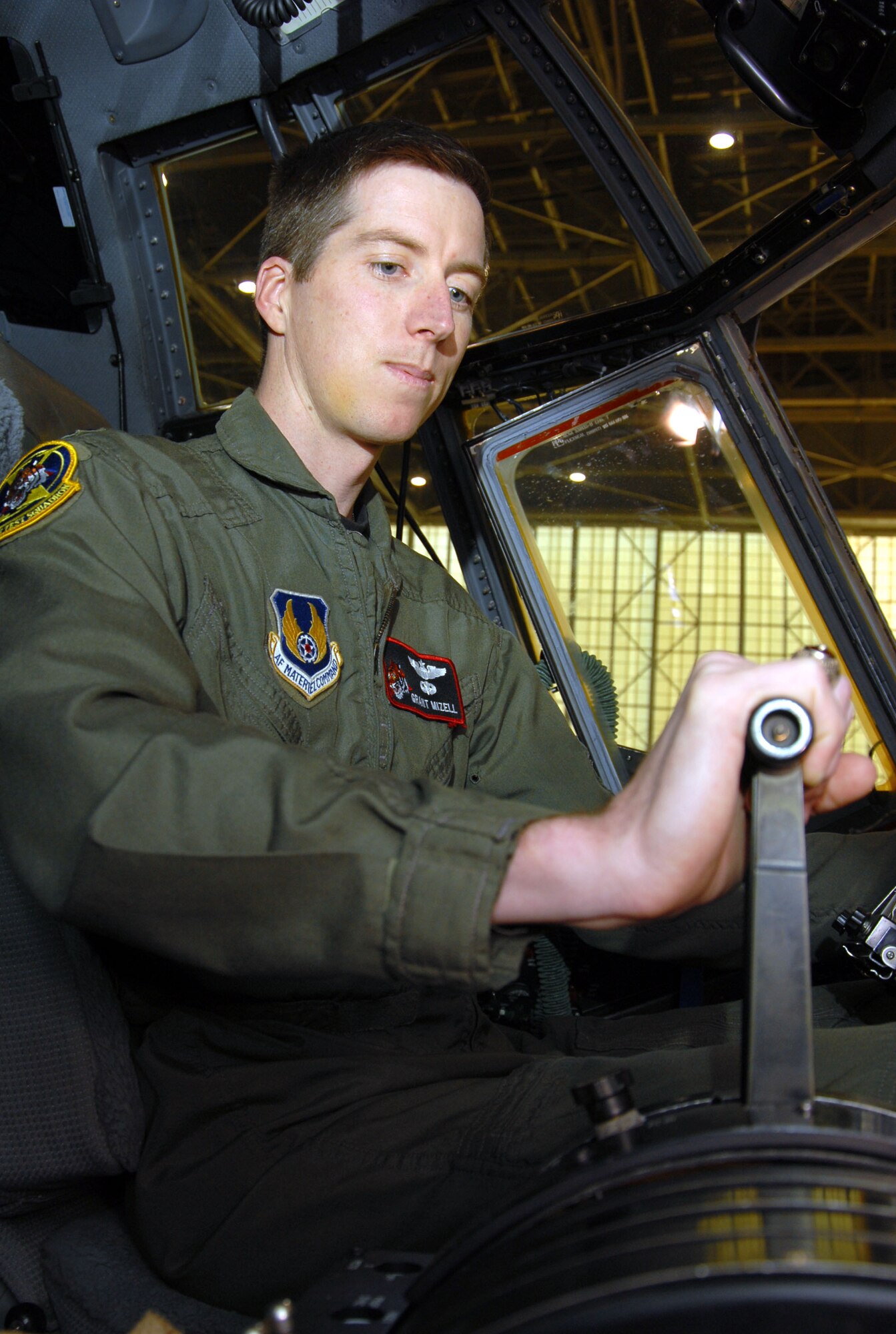 Capt. Grant Mizell, 418th Flight Test Squadron lead project test pilot, checks the C-130H Hercules' controls in hangar 1600 here March 5. The 418th FLTS replaced the four-bladed propellers with the new eight-bladed NP-2000 propellers in support of the New York Air National Guard’s Operation Deep Freeze mission in Antarctica. (Air Force photo by Senior Airman Julius Delos Reyes)