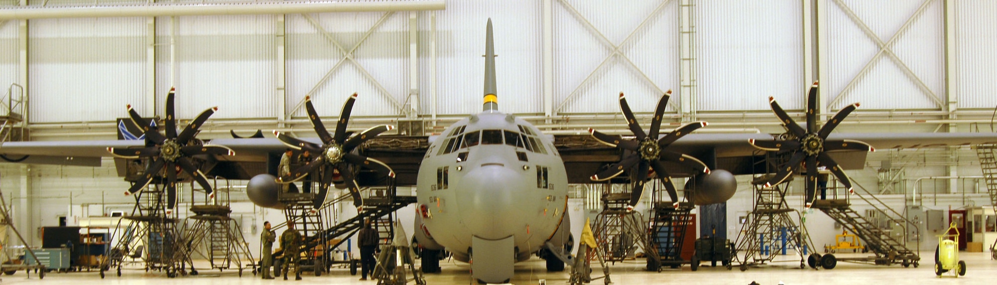 A Wyoming Air National Guard C-130H Hercules sits in hangar 1600 after the 418th Flight Test Squadron replaced the four-bladed propellers with the new eight-bladed NP-2000 propellers. This is in support of the New York Air National Guard’s Operation Deep Freeze mission in Antarctica. (Air Force photo by Senior Airman Julius Delos Reyes)