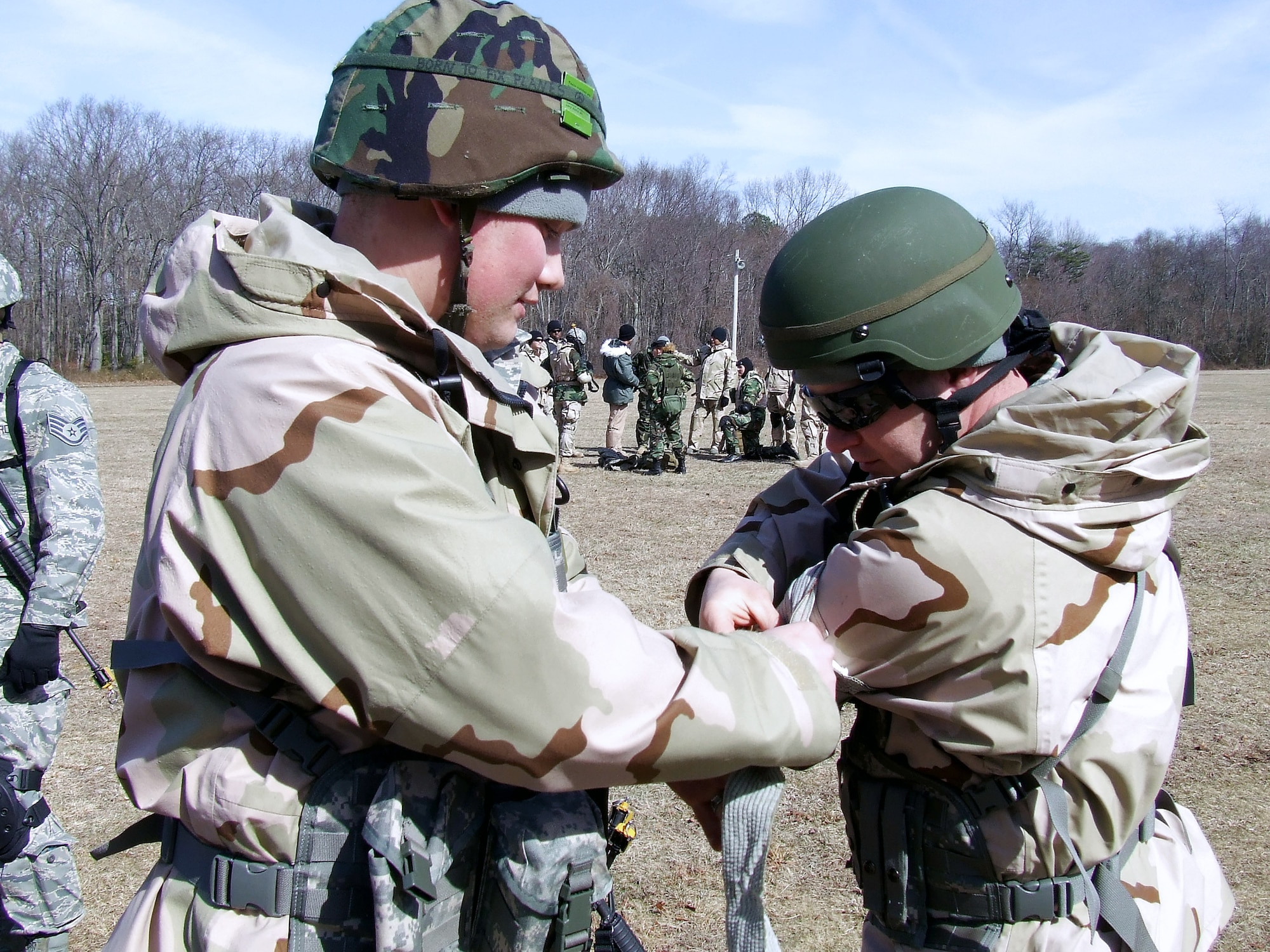 Staff Sgt. Johnathon Ocker and Master Sgt. Daniel Blow participate in the combat first aid obstacle course Feb. 29 on a range on Fort Dix, N.J. Taught by Expeditionary Operations School officials, Air Force Expeditionary Center's Air Advisor Course 08-1 prepares Airmen deploying to Afghanistan and Iraq who will in turn be training military forces in those countries. Both Sergeants Ocker and Blow are from Minot Air Force Base, N.D. (U.S. Air Force photo/Tech. Sgt. Scott T. Sturkol) 
