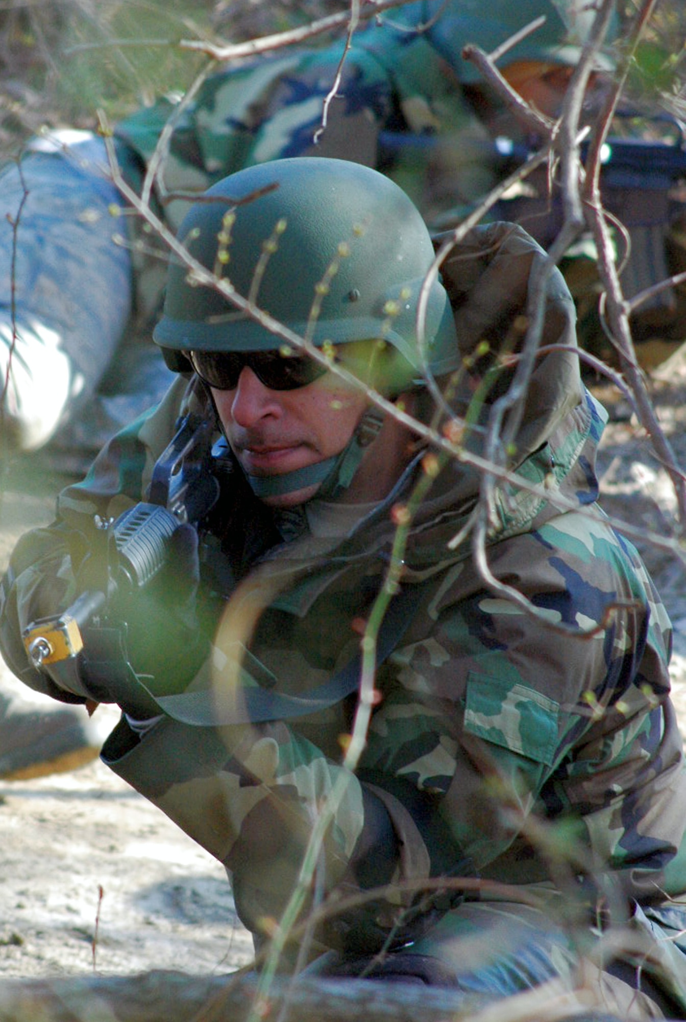 Staff Sgt. Saul Bookman and other students go through the combat first aid obstacle course Feb. 29 on a range on Fort Dix, N.J. Taught by Expeditionary Operations School officials, Air Force Expeditionary Center's Air Advisor Course 08-1 prepares Airmen deploying to Afghanistan and Iraq who will in turn be training military forces in those countries. Sergeant Bookman is from Lackland Air Force Base, Texas. (U.S. Air Force photo/Tech. Sgt. Scott T. Sturkol) 
