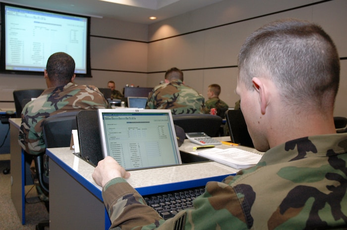 Students in the U.S. Air Force Expeditionary Center's Aerial Port Operations Course work on their computers in the classroom Feb. 20 inside the center on Fort Dix, N.J.  The course, taught by instructors in the center's Mobility Operations School Air Transportation Branch, teaches Airmen in the Air Force air transportation career field subject areas such as air freight, passenger service, air terminal operations and higher headquarters functions. (U.S. Air Force photo/Tech. Sgt. Scott T. Sturkol)